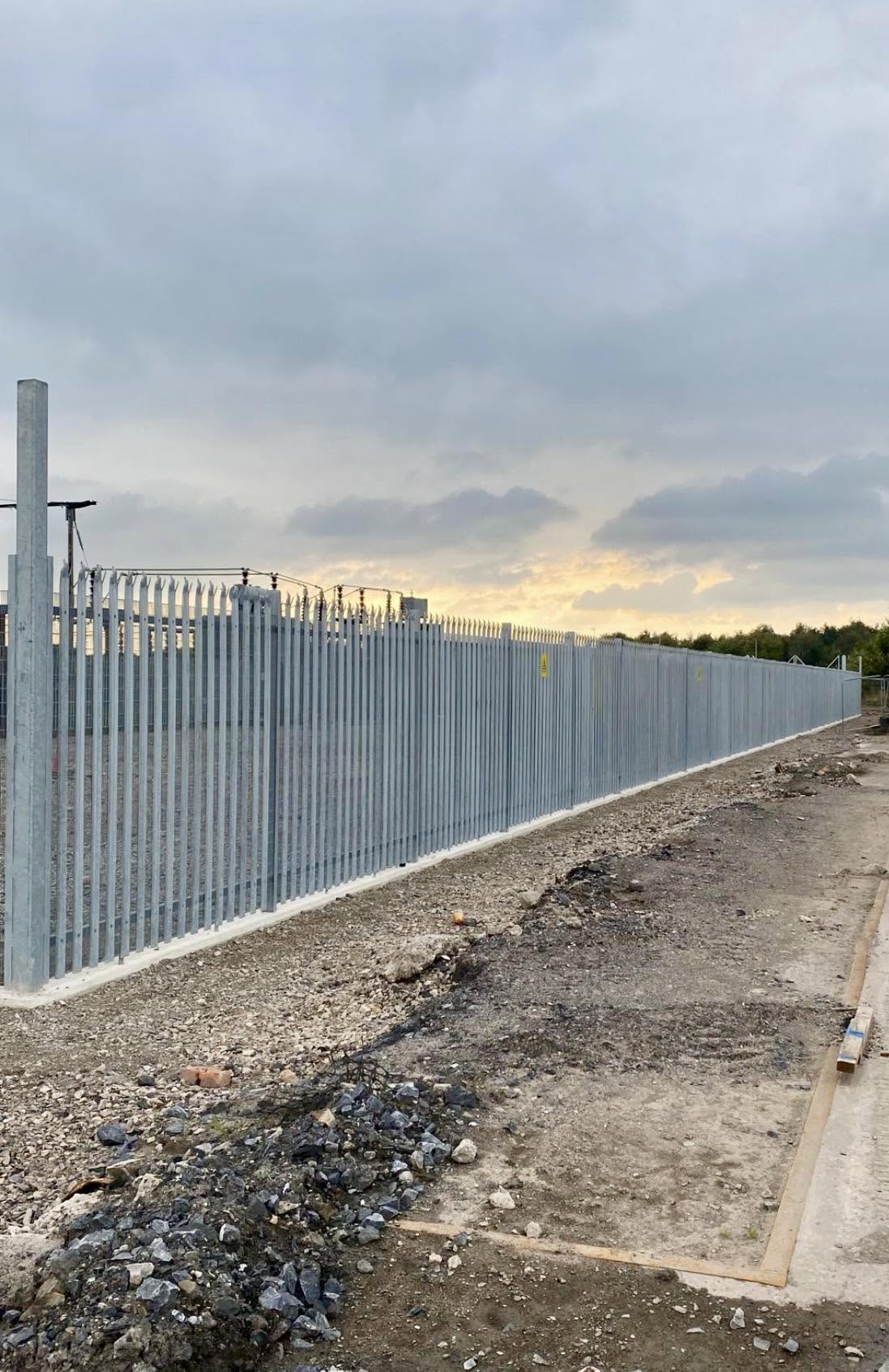 High-security palisade fencing with triple-point pales and rotating anti-climb toppings